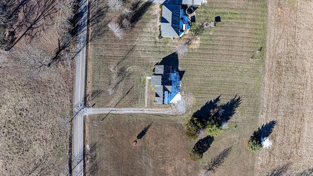 birds eye view of property featuring a rural view