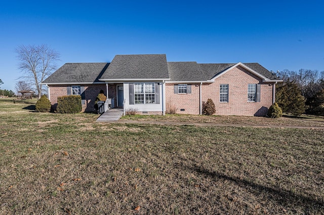 ranch-style house featuring a front yard