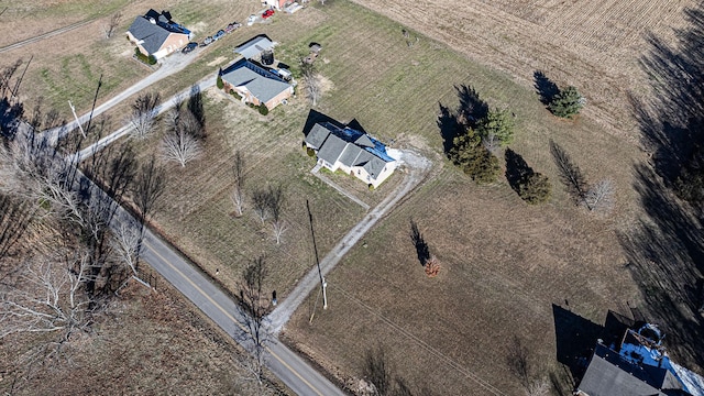 birds eye view of property with a rural view