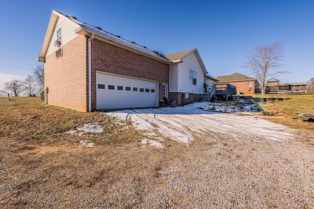 view of front of home with a garage and a deck