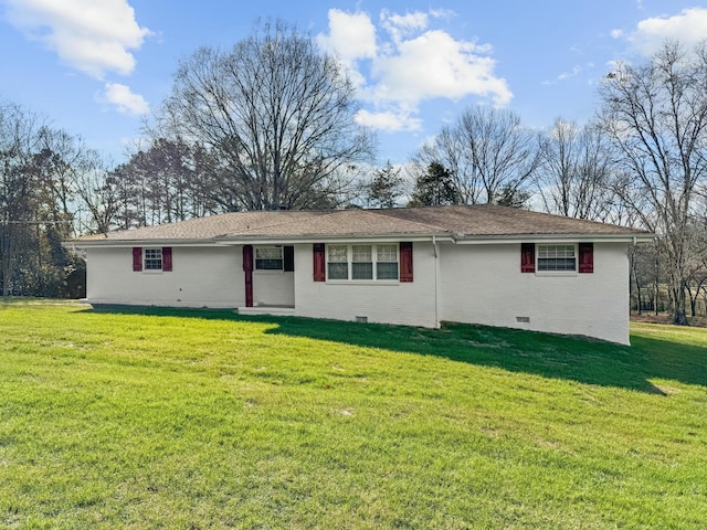 back of house featuring a lawn