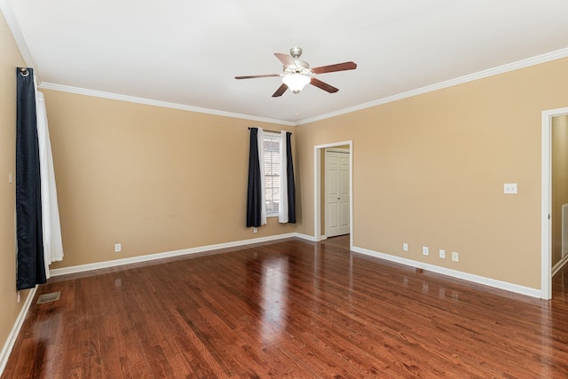 spare room featuring crown molding, dark hardwood / wood-style floors, and ceiling fan