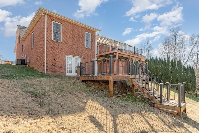 back of house featuring a wooden deck, a lawn, cooling unit, and a pergola