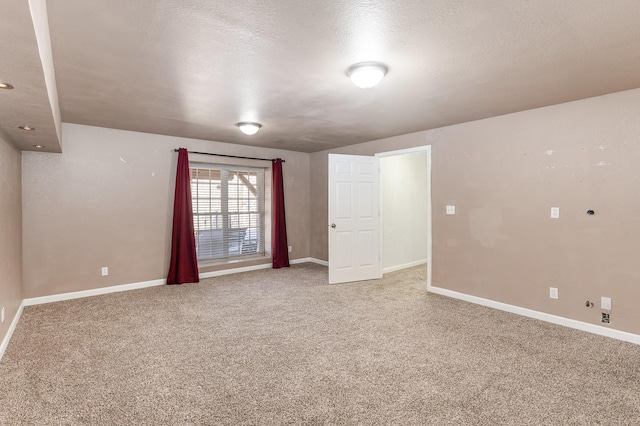 interior space with carpet flooring and a textured ceiling