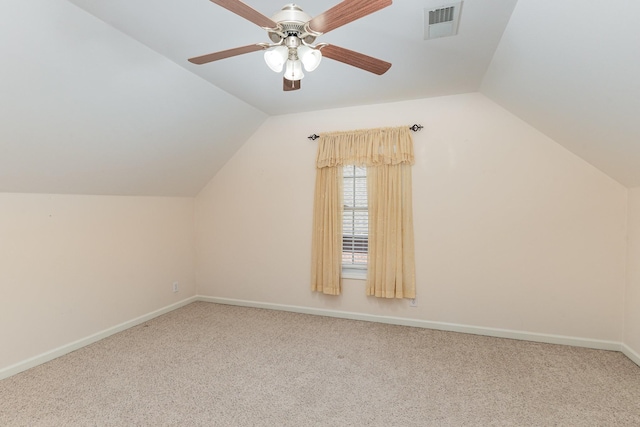 additional living space featuring lofted ceiling, carpet, and ceiling fan