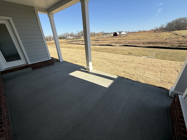 view of patio / terrace featuring a rural view