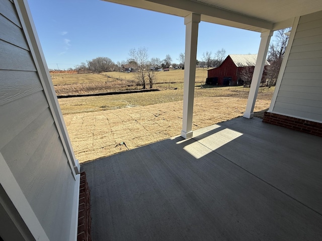 view of patio / terrace with a rural view