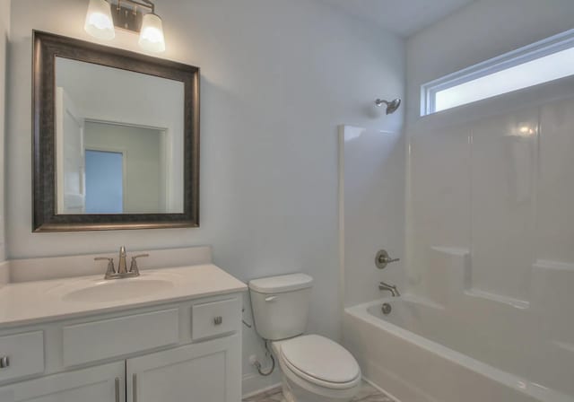 full bathroom featuring vanity, bathing tub / shower combination, and toilet