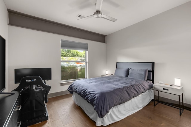 bedroom with hardwood / wood-style floors and ceiling fan