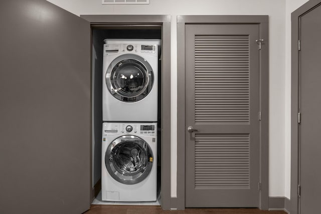 laundry room featuring stacked washer and dryer