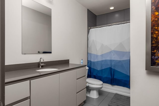 full bathroom with tile patterned flooring, vanity, shower / tub combo, and toilet