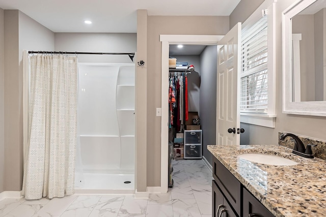 bathroom with a shower with curtain and vanity