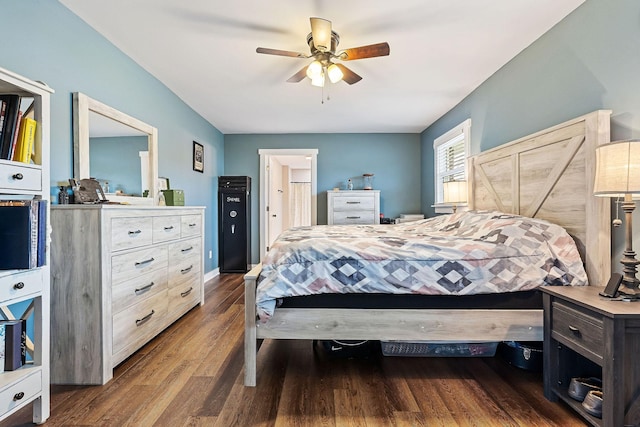 bedroom with ceiling fan and dark wood-type flooring