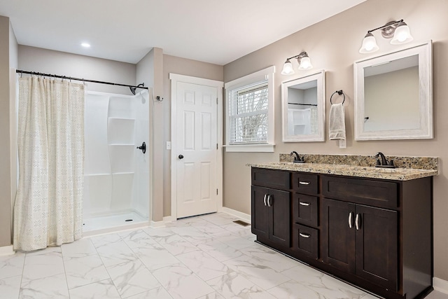 bathroom featuring a shower with curtain and vanity