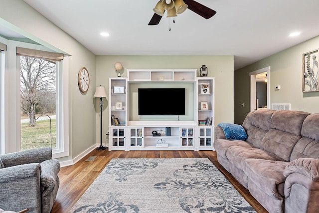 living room with hardwood / wood-style flooring and ceiling fan