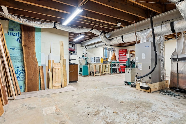 basement with a workshop area and heating unit