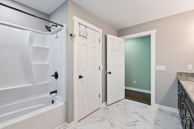 bathroom with vanity and bathing tub / shower combination