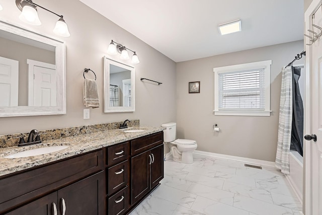 full bathroom featuring vanity, shower / bath combination with curtain, and toilet