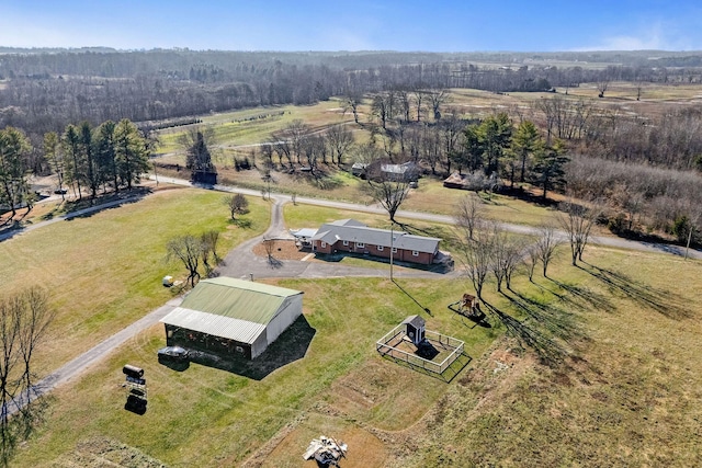 birds eye view of property with a rural view