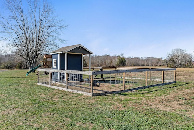 view of outbuilding with a rural view