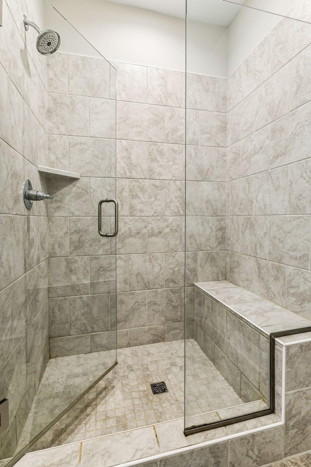 bathroom with a shower with shower door