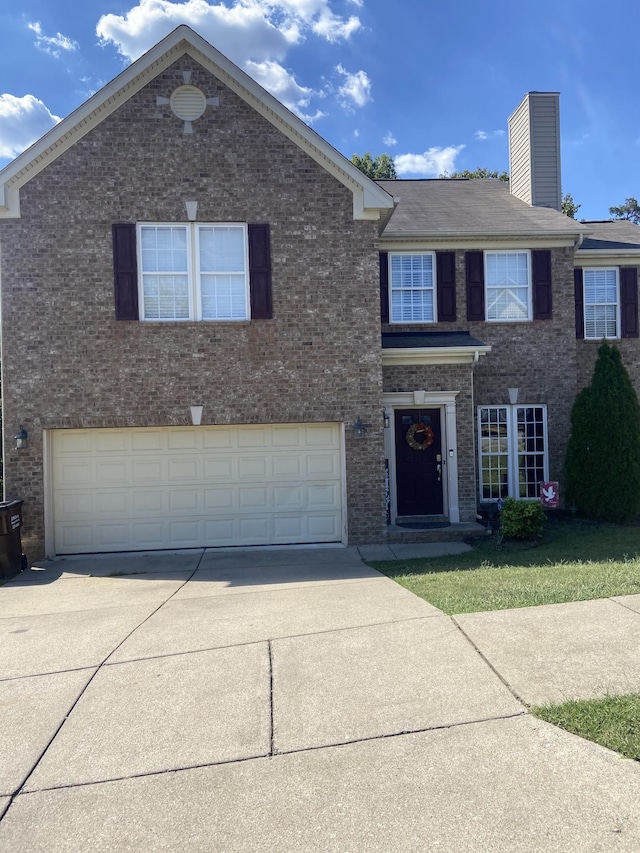 view of front of property with a garage