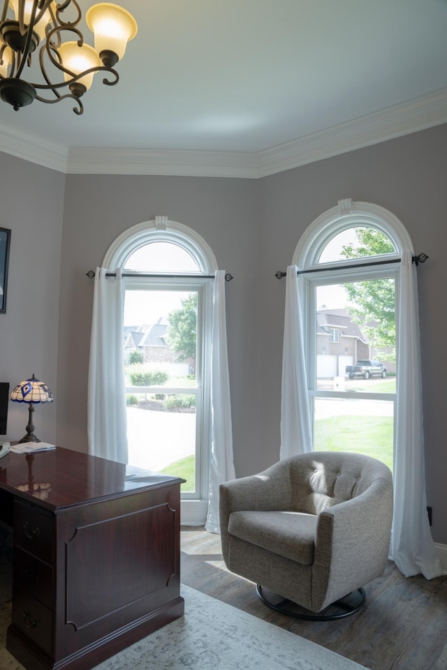 interior space with crown molding, light wood-type flooring, and an inviting chandelier