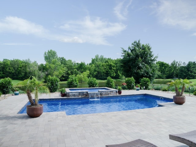 view of pool with a patio area and an in ground hot tub