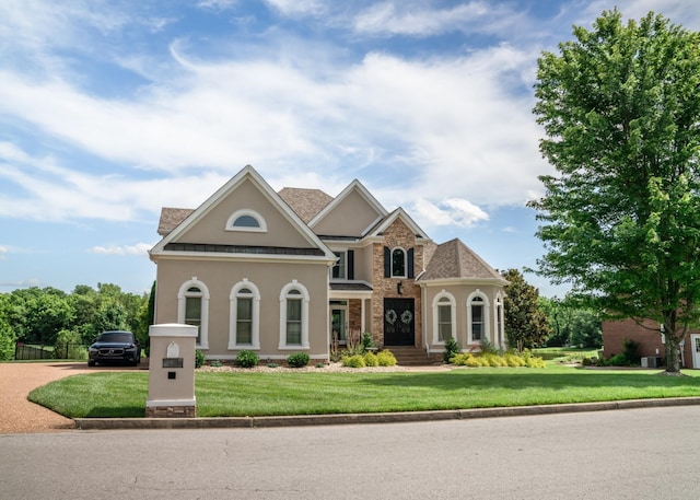 view of front of property with a front lawn