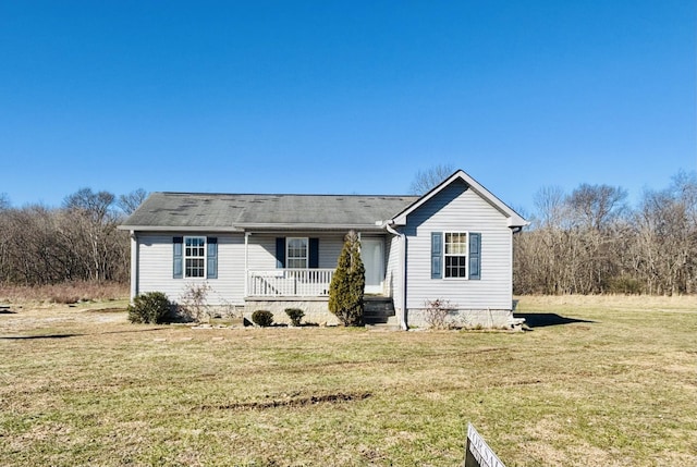 view of front of home with a front yard and covered porch