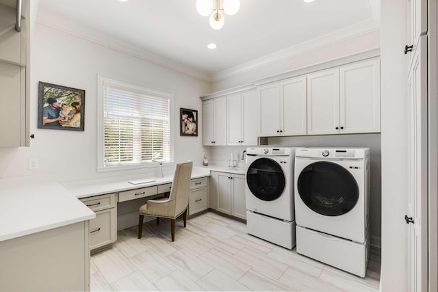 clothes washing area featuring cabinets, separate washer and dryer, and ornamental molding