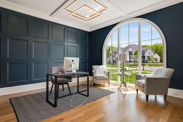 office featuring coffered ceiling, crown molding, and light hardwood / wood-style flooring