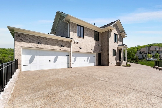 view of side of home with a garage