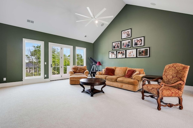 living room with carpet, ceiling fan, french doors, and high vaulted ceiling