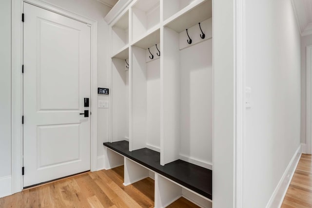 mudroom with light hardwood / wood-style floors