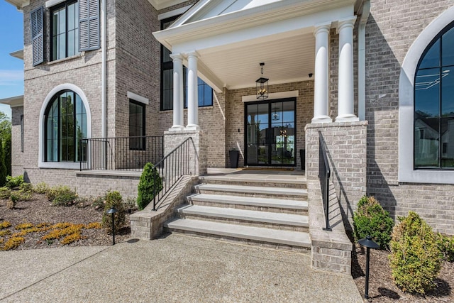 entrance to property featuring covered porch