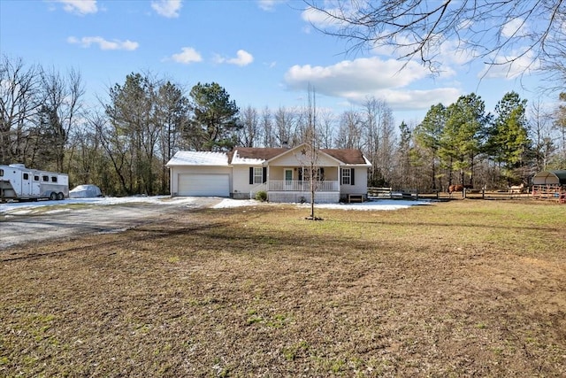 ranch-style house with a front lawn and a garage