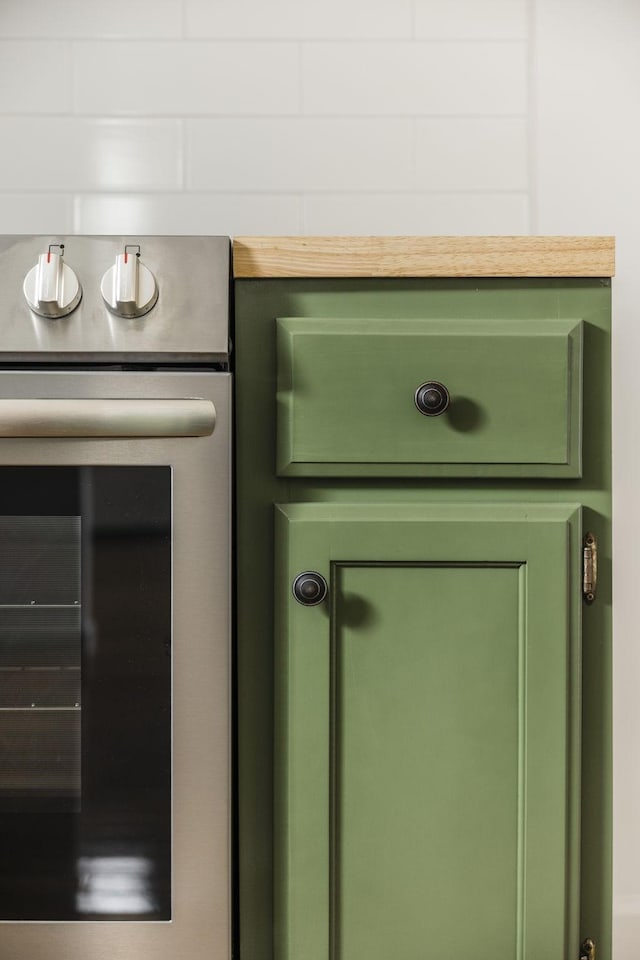 room details with wine cooler and green cabinetry