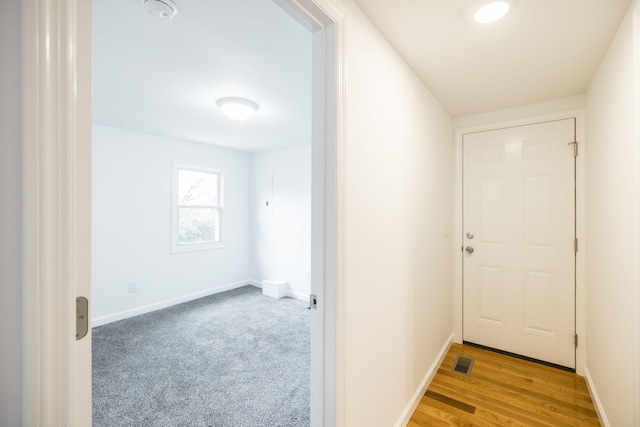 corridor featuring light hardwood / wood-style flooring