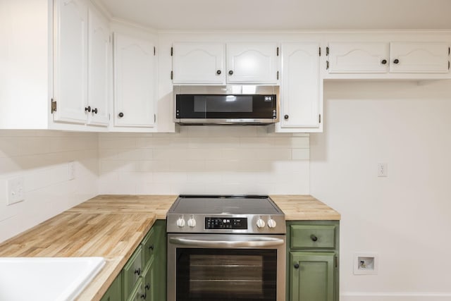 kitchen with stainless steel appliances, tasteful backsplash, green cabinets, wooden counters, and white cabinets