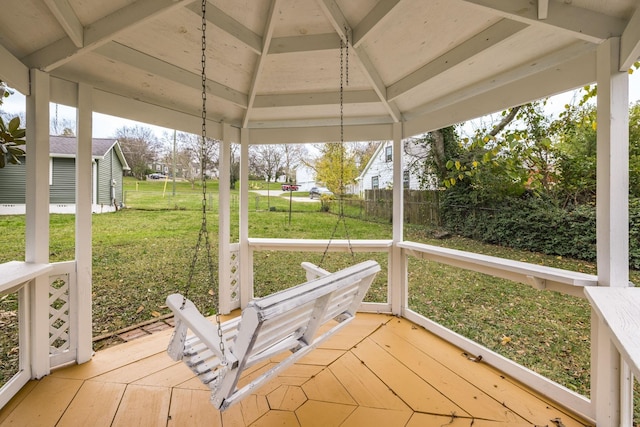 unfurnished sunroom with lofted ceiling