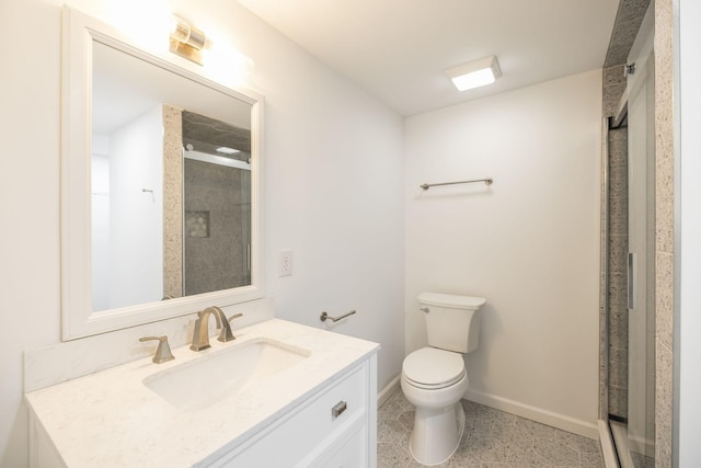 bathroom with a shower with door, vanity, and toilet