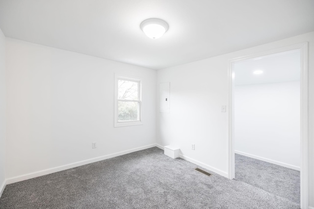 unfurnished room with carpet floors