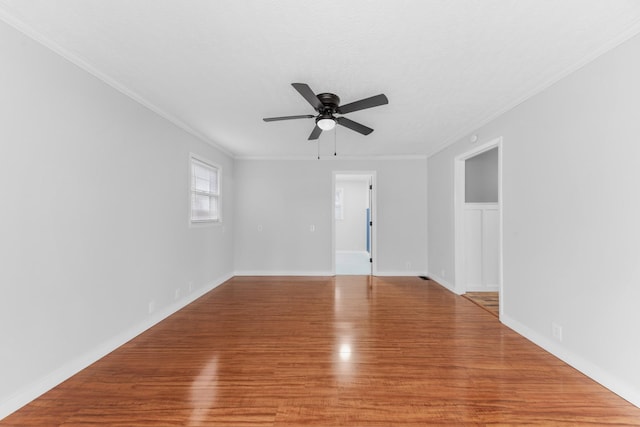 unfurnished room featuring ceiling fan, crown molding, a textured ceiling, and hardwood / wood-style flooring