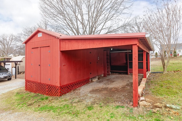 view of outbuilding with a carport