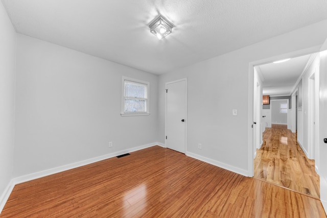 spare room featuring hardwood / wood-style flooring