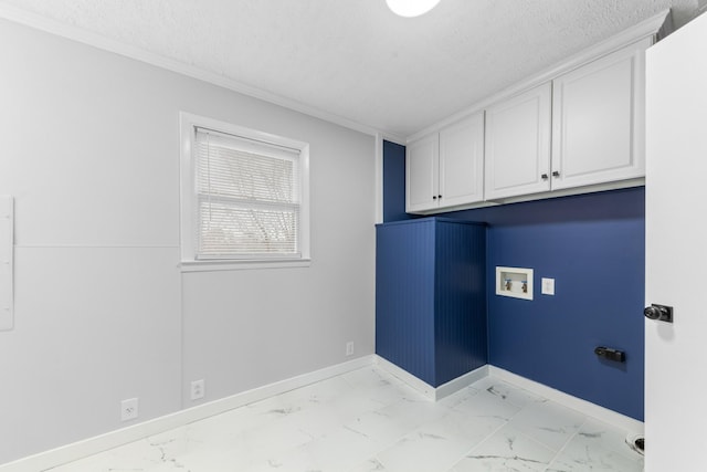 laundry area with crown molding, hookup for a washing machine, and cabinets