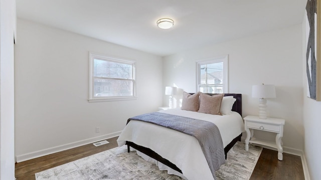 bedroom featuring dark hardwood / wood-style flooring