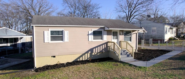 bungalow-style home featuring a front yard