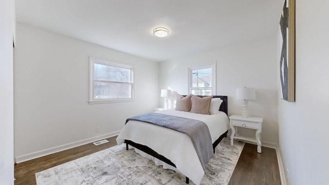 bedroom with hardwood / wood-style flooring